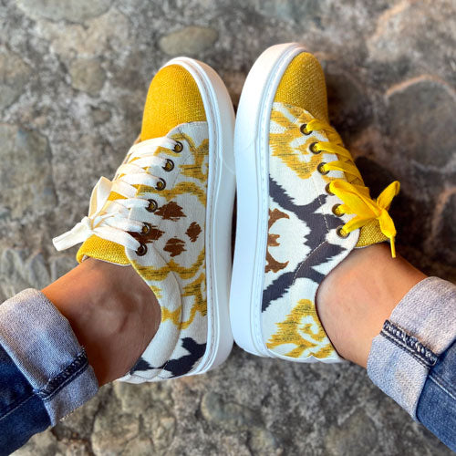 Yellow arabesque tennis shoes