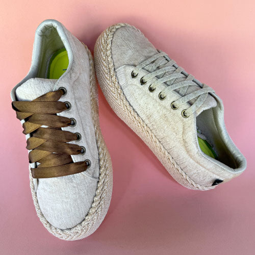 Dalia Cabuya high-top gold tennis shoes